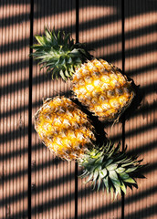 Pineapples with shadow from the light