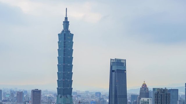 Motion Timelapse of the Taipei 101 and Xinyi District from afternoon to night, shoot at Taipei, Taiwan