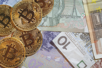 The golden bitcoin on colorful board background, Conceptual image for worldwide crypto currency, huge stack physical version of golden Bitcoin.