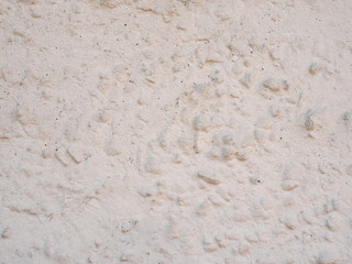 Texture of the plaster. The wall is covered with decorative colored putty. An unusual textured background. Close up