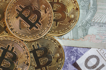 The golden bitcoin on colorful board background, Conceptual image for worldwide crypto currency, huge stack physical version of golden Bitcoin.