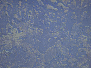 Texture of the plaster. The wall is covered with decorative colored putty. An unusual textured background. Close up