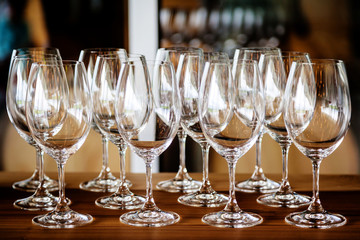Rows of empty wineglasses ready for wine tasting