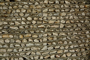 Texture of gray stone wall. Gray stone wall and cement solution as background or texture. 