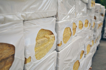 Obraz na płótnie Canvas The texture of mineral wool for insulating the walls. warehouse of products ready for import