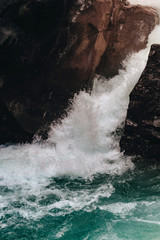 Shaded Rushing Waterfall with like leak