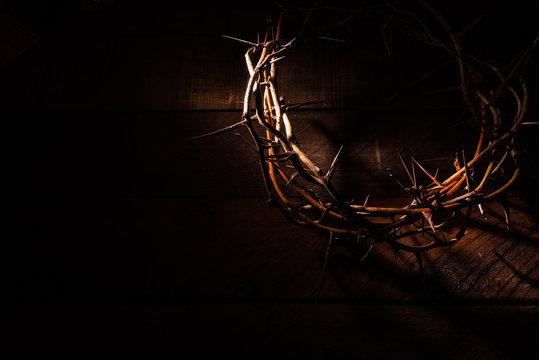 An authentic crown of thorns on a wooden background. Easter Theme