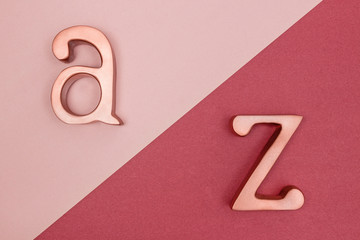 Metal letters on pink and cherry red background