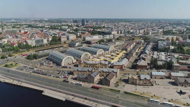 Central market in Riga city historical Europe town living houses and building with roads and cars traffic Drone flight