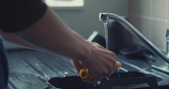Woman washing carrots