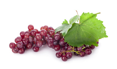 Ripe red grape. Pink bunch with leaves isolated on white. With clipping path