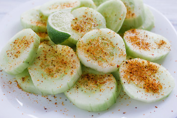 pepinos con chile, Slices of cucumbers and chili, mexican snack, spicy food in mexico