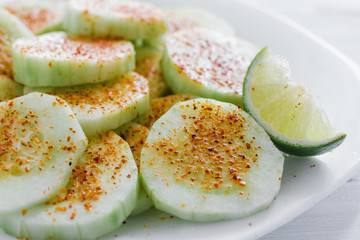 pepinos con chile, Slices of cucumbers and chili, mexican snack, spicy food in mexico