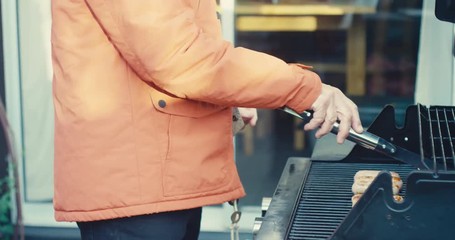 Senior man cooking barbecue