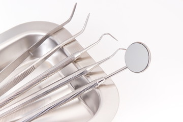Set of dental stainless tools used by dentists in stomatology office