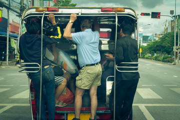 Travelers with Asian minibus