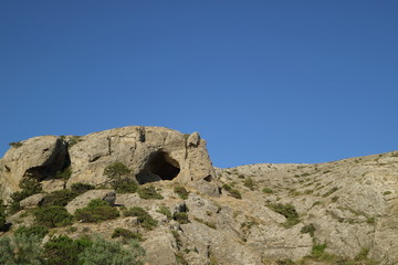 Image of a cave in a rock.