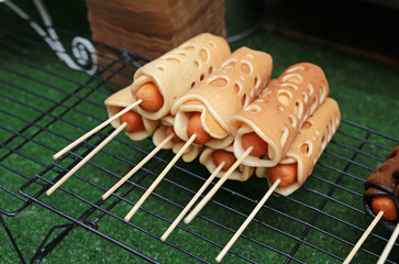 Pancake roll stuffed with hotdog.