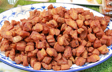 Sweet and sour pork in white plate.