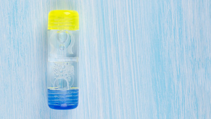 lens storage container with lenses to correct vision on a light background, close-up