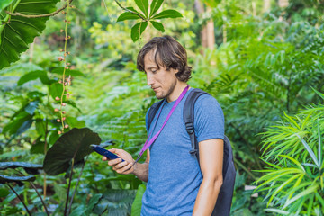 A man listens to a radio guide, tourism concept