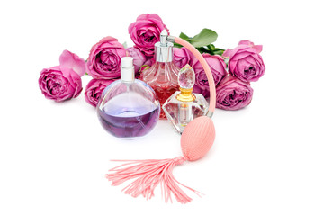 Perfume bottles with flowers on white background. Perfumery, cosmetics, fragrance collection