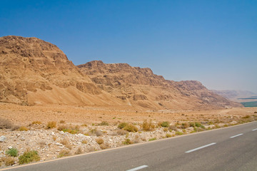 Descend serpentine road on mountain slope along Dead Sea shore. Judean desert, Metzoke Dragot, Israel.