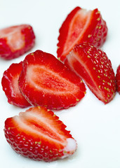 Strawberry with milk cream is cut to make a natural fruit roll of ice cream.