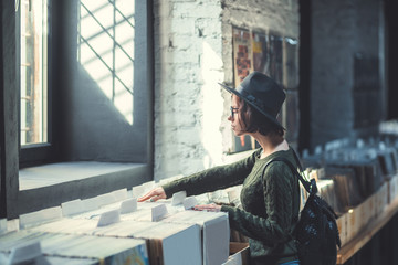 Fototapeta premium Young woman in a music store