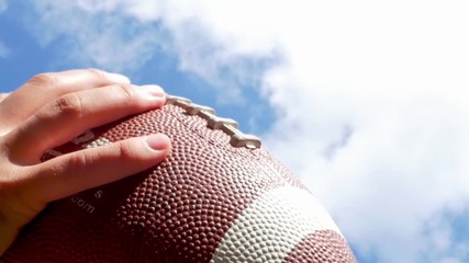 hands catching rugby, football ball, slow motion - Powered by Adobe