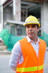 Handsome Persian man construction worker at the construction sit