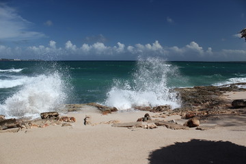 sandy beach with a big wave at sea on the island of Cuba
