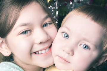 Portrait of two beautiful girls sisters