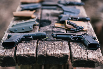 Guns for shooting sports lie on the old table