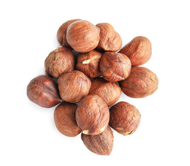 Tasty hazelnuts on white background