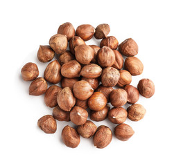 Tasty hazelnuts on white background
