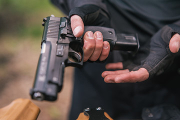 sports shooting instructor check your weapons close-up