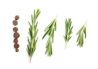 Fresh rosemary with allspice on white background