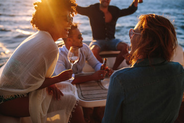 Woman enjoying a boat party with friends
