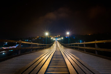View of the long wooden bridge at night and star Light in sangkhlaburi kanchacaburi THAILAND
