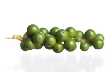 Fresh black pepper on white background