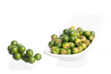 Fresh black pepper on white background