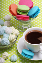 A cup of coffee and macaroons ready for breakfast