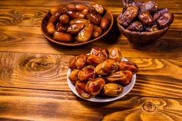 Date fruits on the rustic wooden table