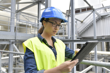 Industrial engineer standing in recycling plant