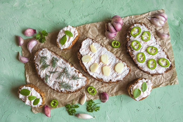 Bread with smeared garlic cream. Appetizer with garlic sauce.
