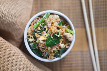 Fried instant noodles with minced pork, egg and vegetable