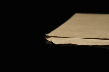 An edge of a brown envelope.