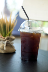 Plastic cup of iced black coffee americano