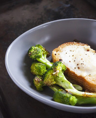 Toast with egg and broccoli. In style of wabi-Sabi.